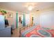 Bedroom with access to the dining room and kitchen at 42 Caroll Cir, Englewood, FL 34223
