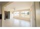 Bright living room featuring two large windows with a tranquil view of the canal at 42 Caroll Cir, Englewood, FL 34223