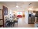 Inviting living space with dining area, stainless steel appliances, tile floors, and ample natural light at 42 Caroll Cir, Englewood, FL 34223