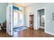 Bright and airy entryway with hardwood floors and decorative accents at 592 Boundary Blvd, Rotonda West, FL 33947