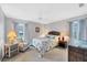 Spacious bedroom with a queen-size bed and coastal decor at 618 Deerwood Ave, Englewood, FL 34223