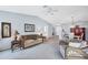 Comfortable living room with dining area and access to other rooms at 618 Deerwood Ave, Englewood, FL 34223