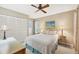 Comfortable bedroom with a queen-size bed and built-in closet at 618 Deerwood Ave, Englewood, FL 34223