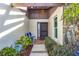 Inviting entryway with a brick path, and well-maintained landscaping at 618 Deerwood Ave, Englewood, FL 34223