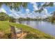 Peaceful community lake view with bench at 618 Deerwood Ave, Englewood, FL 34223