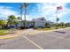 Community center with parking lot and American flag at 618 Deerwood Ave, Englewood, FL 34223