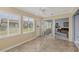 Sunroom with tile floor, sliding glass doors and backyard access at 618 Deerwood Ave, Englewood, FL 34223