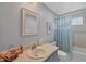 Bathroom features a single sink vanity and shower/tub combo at 618 Deerwood Ave, Englewood, FL 34223