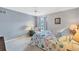 Bright bedroom with a queen bed, ceiling fan, and neutral decor at 618 Deerwood Ave, Englewood, FL 34223