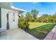 Spacious backyard with lush grass and an outdoor shower at 7212 Teaberry St, Englewood, FL 34224