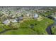 Aerial view of waterfront homes and lush landscaping at 8025 Weyers Ct, Englewood, FL 34224