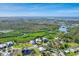 Beautiful aerial view of the home, community, and waterways at 8025 Weyers Ct, Englewood, FL 34224