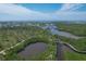 Aerial view of waterfront property and boardwalk at 8025 Weyers Ct, Englewood, FL 34224