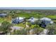 Aerial view of two luxury waterfront homes with private driveways at 8025 Weyers Ct, Englewood, FL 34224