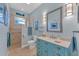 Bathroom with a walk-in shower and a stylish vanity at 8025 Weyers Ct, Englewood, FL 34224