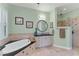 Bathroom with walk-in shower and a large vanity at 8025 Weyers Ct, Englewood, FL 34224