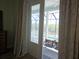 Bedroom with private access to a screened lanai and pool area at 8025 Weyers Ct, Englewood, FL 34224