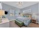 Guest bedroom with a queen-size bed and plenty of natural light at 8025 Weyers Ct, Englewood, FL 34224