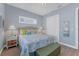 Bedroom with queen-size bed, and a built-in bench at the foot of the bed at 8025 Weyers Ct, Englewood, FL 34224