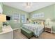 Bright bedroom with king-size bed and calming decor at 8025 Weyers Ct, Englewood, FL 34224