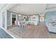 Open dining area with table and chairs, adjacent to kitchen and living room at 8025 Weyers Ct, Englewood, FL 34224