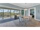 Cozy dining room with access to the screened-in porch at 8025 Weyers Ct, Englewood, FL 34224