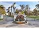 Gated entrance to community with fountain at 8025 Weyers Ct, Englewood, FL 34224