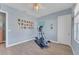 Home gym with elliptical and wall decor at 8025 Weyers Ct, Englewood, FL 34224