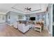 Spacious living room with a tray ceiling and beautiful hardwood floors at 8025 Weyers Ct, Englewood, FL 34224