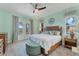 Comfortable main bedroom featuring a private entrance to the porch at 8025 Weyers Ct, Englewood, FL 34224