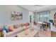 Relaxing home office features a large desk, built-in shelving, and comfortable seating area at 8025 Weyers Ct, Englewood, FL 34224
