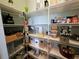 Well-organized pantry with ample shelving for storage at 8025 Weyers Ct, Englewood, FL 34224