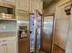 Stainless steel refrigerator with water and ice dispenser at 8025 Weyers Ct, Englewood, FL 34224