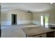 Spacious living room with vaulted ceilings and tiled flooring at 9992 Antler St, Port Charlotte, FL 33981