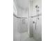 Walk-in shower with built-in seat and multiple shower heads at 100 Pine Valley Ln, Rotonda West, FL 33947