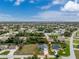 Single Gathering home with a large backyard, situated in a residential neighborhood at 10127 Peach Ave, Englewood, FL 34224