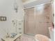 Bathroom with a shower stall and decorative details at 10127 Peach Ave, Englewood, FL 34224