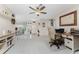 Bright home office space with built-in desk and view of the entryway at 10127 Peach Ave, Englewood, FL 34224