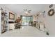 Well-lit home office featuring neutral tones and sliding glass doors to the outdoor patio at 10127 Peach Ave, Englewood, FL 34224