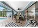 Relaxing pool area with patio furniture and screened enclosure at 10127 Peach Ave, Englewood, FL 34224