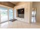 Modern kitchen with white cabinets and wood-like backsplash at 10413 Grail Ave, Englewood, FL 34224