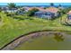 Aerial view of waterfront home with private pool and tropical landscaping at 12960 N Marsh Dr, Port Charlotte, FL 33953
