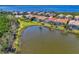 Aerial view of waterfront community with houses and lush vegetation at 12960 N Marsh Dr, Port Charlotte, FL 33953