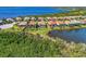 Aerial view of waterfront home with private pool and backyard at 12960 N Marsh Dr, Port Charlotte, FL 33953