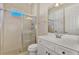 Clean bathroom with a walk-in shower and white vanity at 12960 N Marsh Dr, Port Charlotte, FL 33953