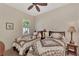 Charming bedroom with twin beds and window seating at 12960 N Marsh Dr, Port Charlotte, FL 33953