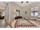 Bedroom with twin beds, dresser and view into home office at 12960 N Marsh Dr, Port Charlotte, FL 33953