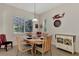 Charming breakfast nook features a wood table and built-in storage at 12960 N Marsh Dr, Port Charlotte, FL 33953
