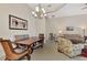 Dining room with wooden table, chairs, and a view into the living room at 12960 N Marsh Dr, Port Charlotte, FL 33953