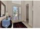 Bright and spacious foyer with decorative rug and furniture at 12960 N Marsh Dr, Port Charlotte, FL 33953